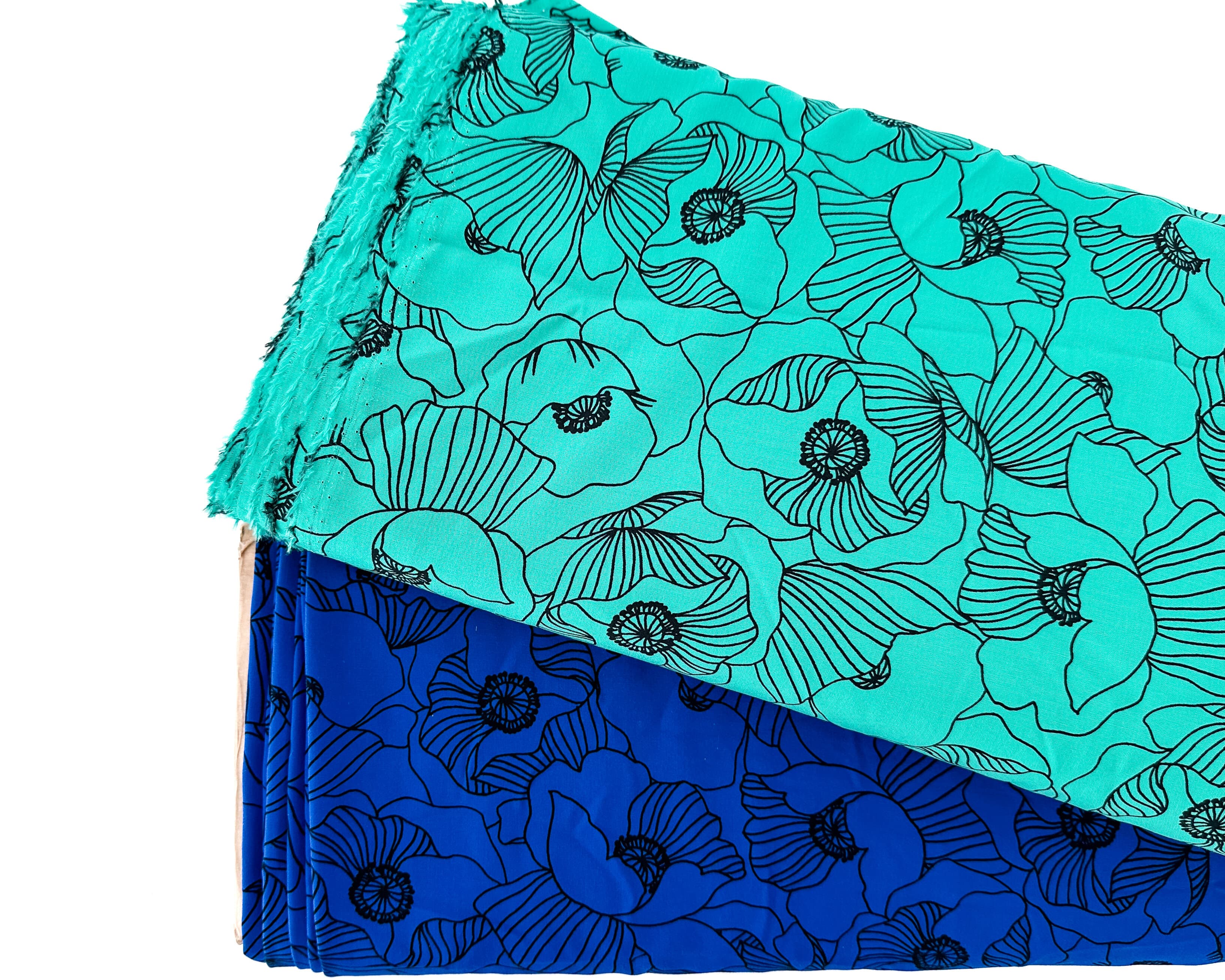 Two bold designs from our latest designer deadstock fabric drop are featured. One in a vibrant green shade with hand drawn style poppies. The second fabric features the same design in a vibrant cobalt shade. Designer Deadstock fabric NZ 